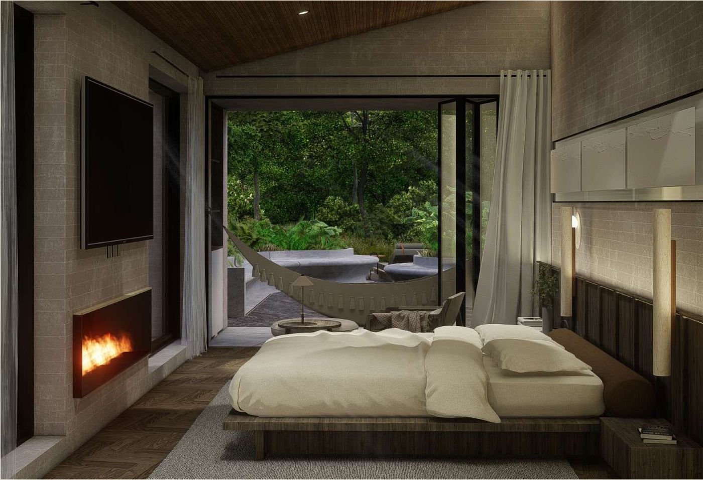 Habitación principal de Casa Pelmon con chimenea y vista al bosque.